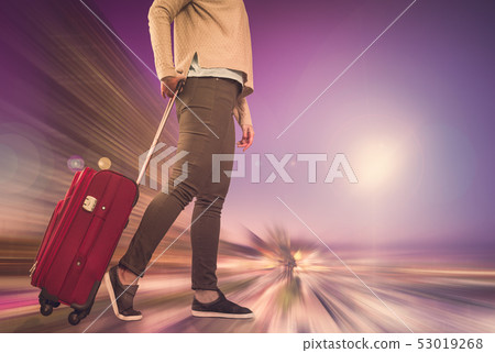 Girl with suitcase on wheels 53019268