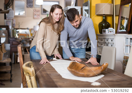 Couple satisfied with table at home Couple satisfied with table at home 53019292