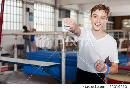 Happy teenage boy in gym 53019310