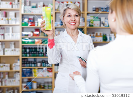 Laughing seller recommending care products 53019312
