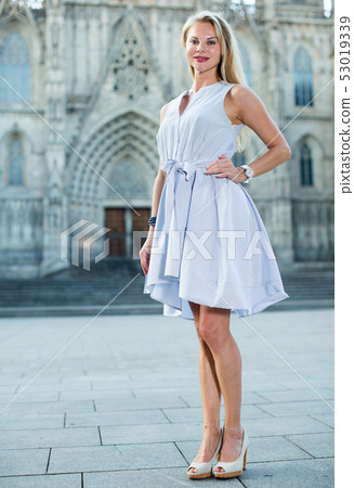 Glad female in the dress at the street Glad female in the dress at the street 53019339