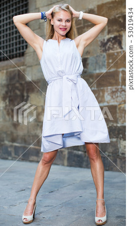 Portrait of cheerful woman at the street 53019434