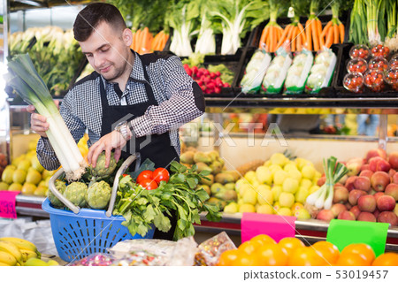 Male seller helping to choose 53019457