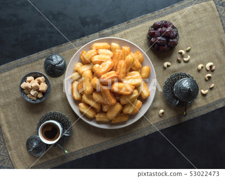 Arabic sweets Tulumba, celebration Eid Ramadan. Arabic sweets Tulumba, celebration Eid Ramadan. 53022473