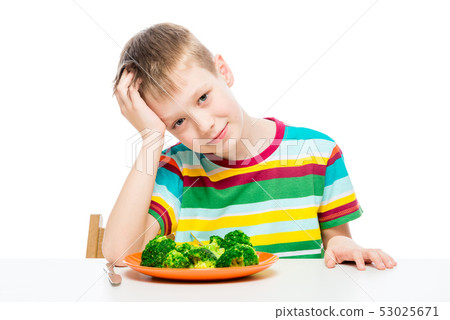 Child and a plate of broccoli, concept photo food 53025671