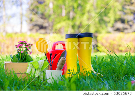 rubber boots next to the tools for working in the 53025673