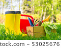 garden tools, watering can and gardener's boots 53025676
