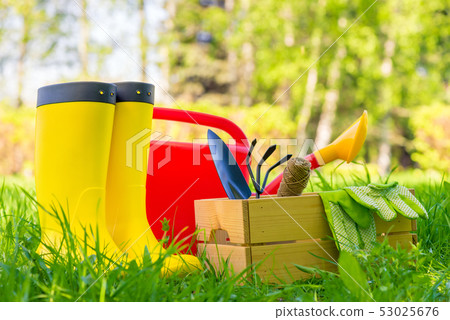 garden tools, watering can and gardener's boots garden tools, watering can and gardener's boots 53025676