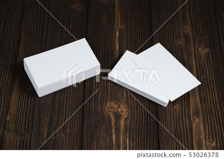 Blank business cards on wooden working table with 53026378