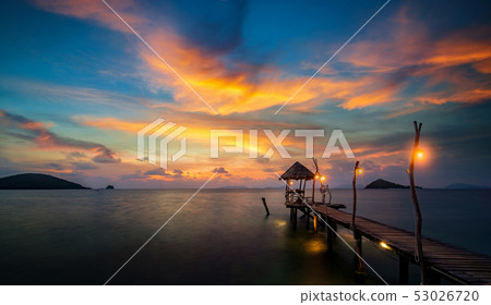 Wooded bridge in Koh Nak with sunset sky Wooded bridge in Koh Nak with sunset sky 53026720