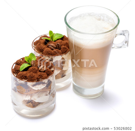 Classic tiramisu dessert in a glass and cup of coffee isolated on a white background with clipping Classic tiramisu dessert in a glass and cup of coffee isolated on a white background with clipping 53026802