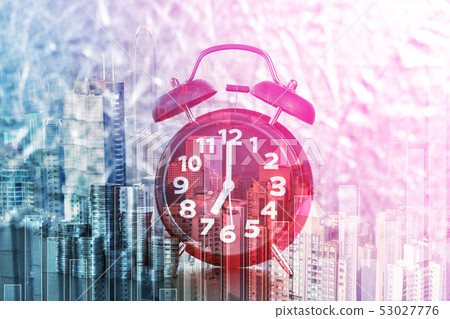 Double exposure of alarm clock and coins stacks 53027776