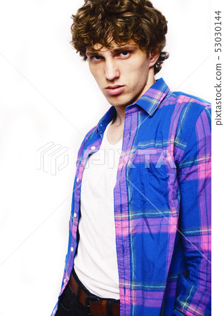 Portrait of a smart serious young man standing against white background, lifestyle people concept Portrait of a smart serious young man standing against white background, lifestyle people concept 53030144