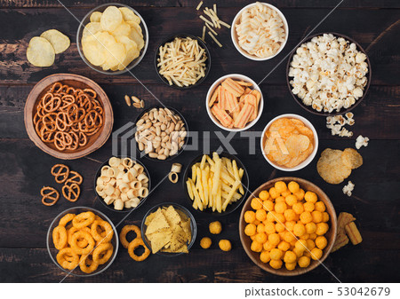 All classic potato snacks with peanuts, popcorn 53042679