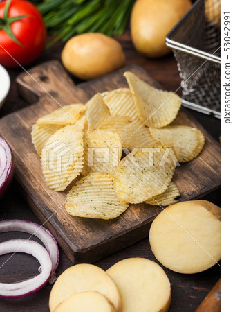 Fresh organic homemade potato crisps chips Fresh organic homemade potato crisps chips 53042991