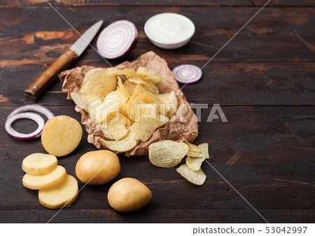 Fresh organic homemade potato crisps chips Fresh organic homemade potato crisps chips 53042997
