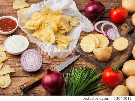 Fresh organic homemade potato crisps chips  53043011