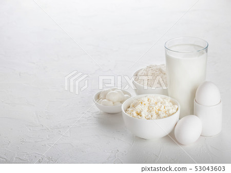 Fresh dairy products on white table background. Fresh dairy products on white table background. 53043603