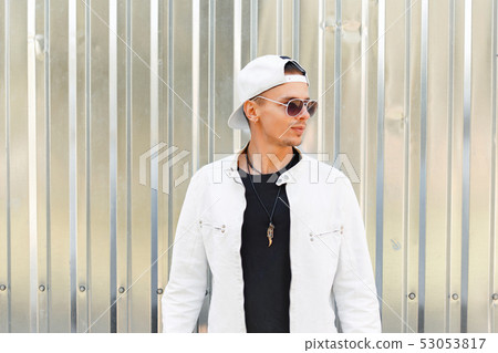 handsome young man in a fashionable jacket 53053817