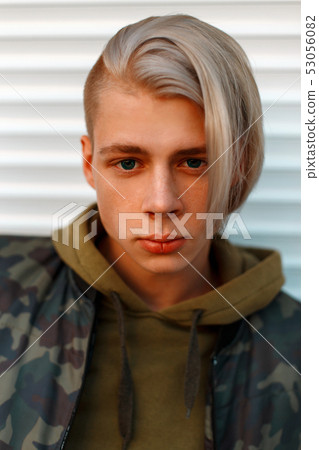 Portrait of a handsome young man with hair 53056082