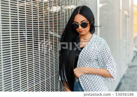 Fashionable beautiful woman with round sunglasses 53056186