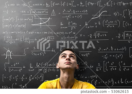 Boy looks apprehensively at a mathematical formula 53062615