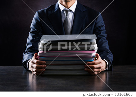 Businessman with lots of work 53101603