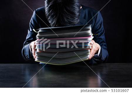 Businessman with lots of work 53101607