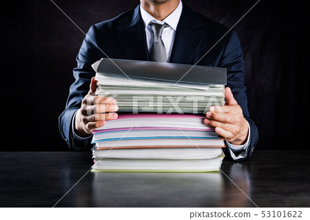 Businessman with lots of work 53101622