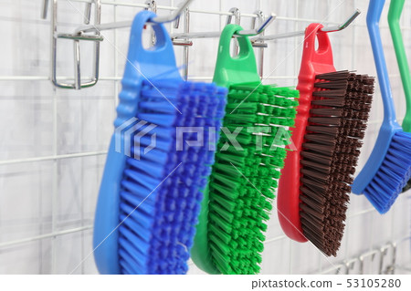 plastic cleaning brushes in supermarket hanger ; plastic cleaning brushes in supermarket hanger ; 53105280