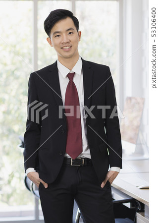 Asian Businessman standing and posing in office.. 53106400
