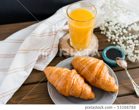 delicious breakfast with croissants, flowers and juice, good morning 53108788
