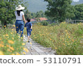 Mom and son walking and happiness in a nature 53110791