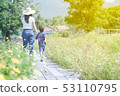 Mom and son walking and happiness in a nature 53110795
