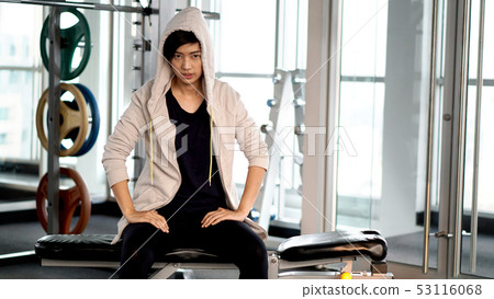 Asian sport woman resting after exercise at gym Asian sport woman resting after exercise at gym 53116068