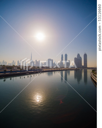 Panorama of the city of Dubai early in the morning at sunrise with a bridge over the city channel Panorama of the city of Dubai early in the morning at sunrise with a bridge over the city channel 53116660