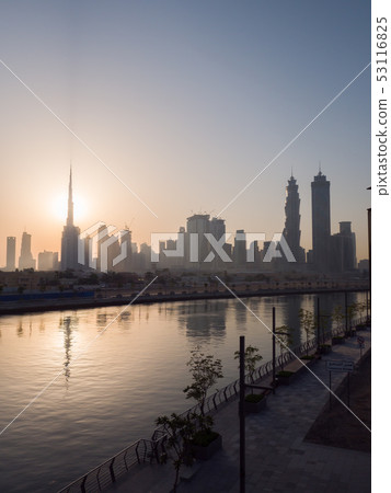 Panorama of the city of Dubai early in the morning at sunrise with a bridge over the city channel Panorama of the city of Dubai early in the morning at sunrise with a bridge over the city channel 53116825