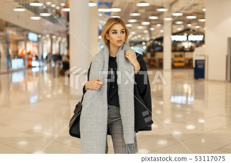 Fashionable beautiful woman in a trendy coat 53117075