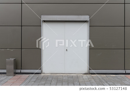 sidewalk by street wall & door sidewalk by street wall & door 53127148