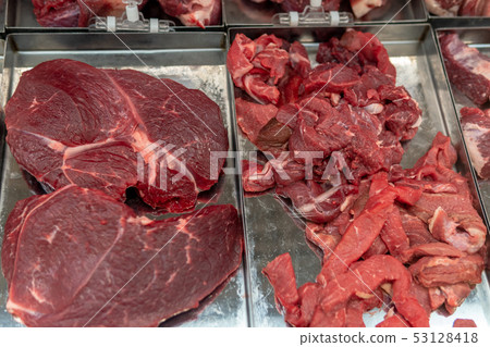 Raw meat chilled in a supermarket showcase 53128418