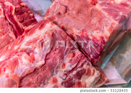 Raw meat chilled in a supermarket showcase 53128435