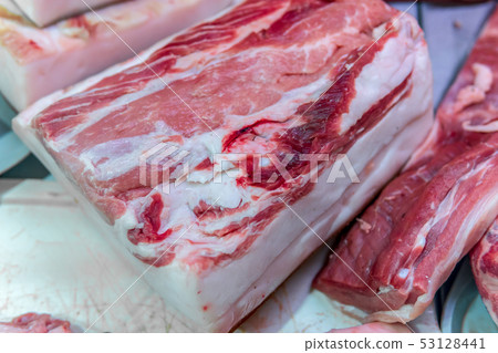 Raw meat chilled in a supermarket showcase 53128441