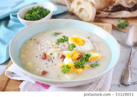 Polish soup Zurek with sausage, potatoes and eggs Polish soup Zurek with sausage, potatoes and eggs 53129051