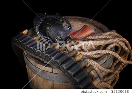Old wild west gun with cartridges and gunbelt Old wild west gun with cartridges and gunbelt 53130618