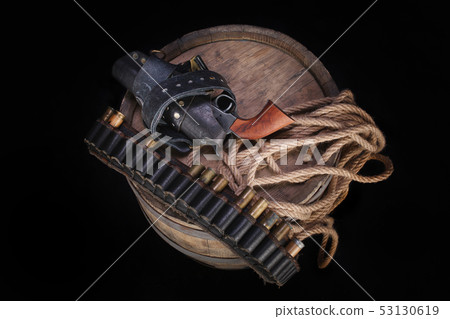 Old wild west gun with cartridges and gunbelt Old wild west gun with cartridges and gunbelt 53130619