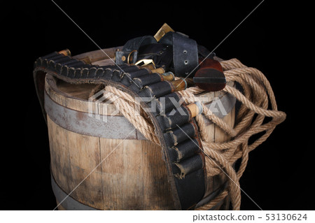 Old wild west gun with cartridges and gunbelt 53130624