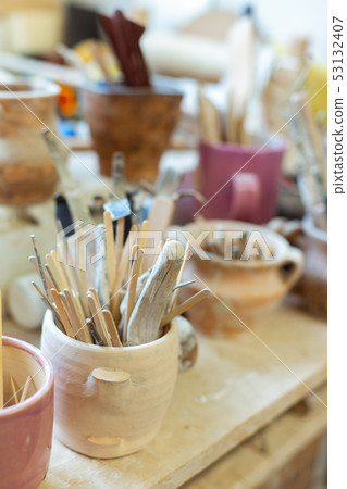 Tools and pottery materials being organized in deep bowls Tools and pottery materials being organized in deep bowls 53132407