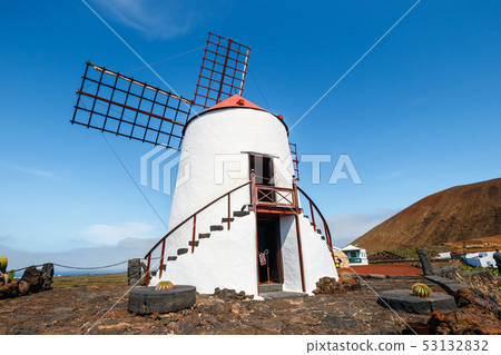 Windmill on blue sky background in cactus garden, Windmill on blue sky background in cactus garden, 53132832