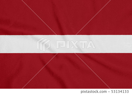 Flag of Latvia on textured fabric. Patriotic Flag of Latvia on textured fabric. Patriotic 53134133