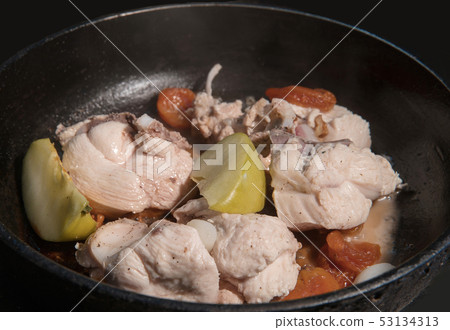 cooking chicken breast-stewing with dried apricots 53134313